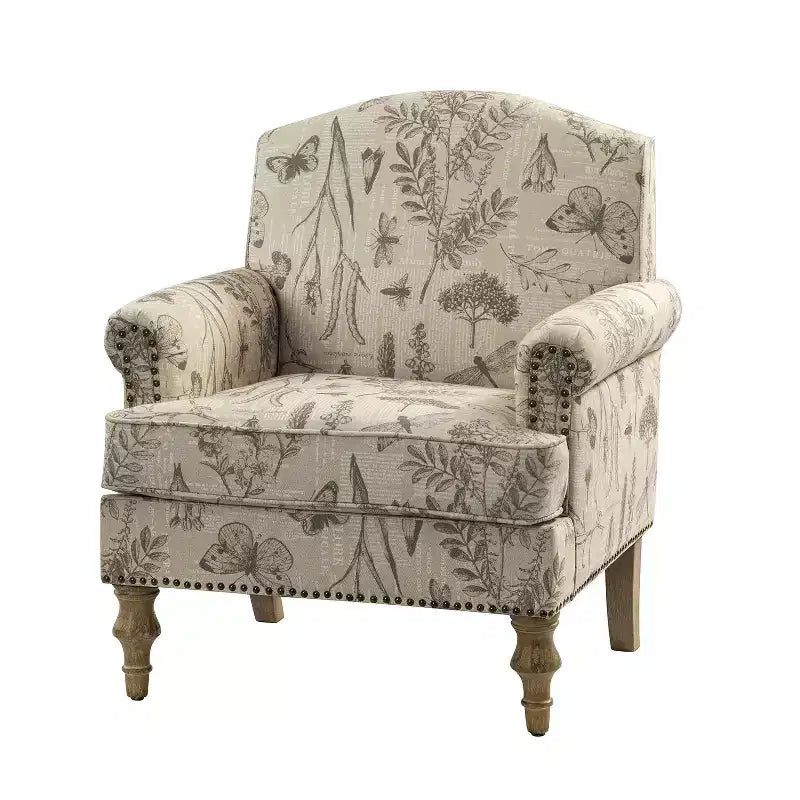 Fauteuil rembourré en bois avec motif floral, accoudoirs à panneaux et dossier en forme de bosse de chameau.