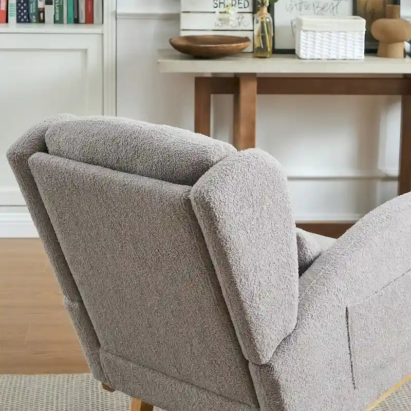 Fauteuil à bascule moderne à dossier haut pour salon, avec deux poches latérales