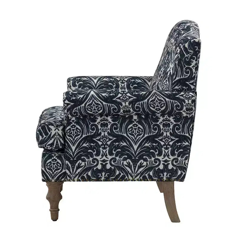 Fauteuil rembourré en bois avec motif floral, accoudoirs à panneaux et dossier en forme de bosse de chameau.
